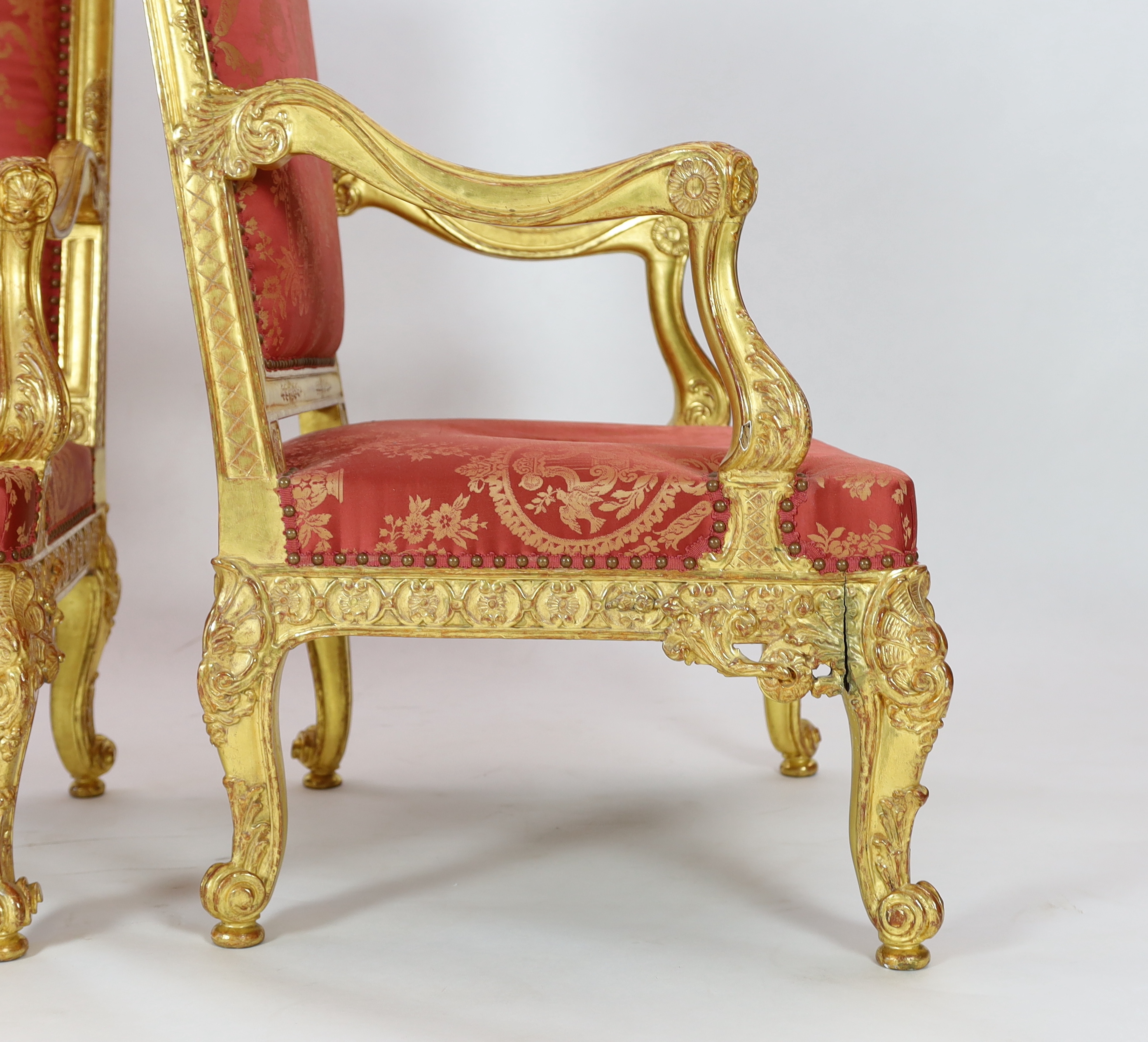 A pair of Louis XV style carved giltwood fauteuils Please note this lot attracts an additional import tax of 5% on the hammer price